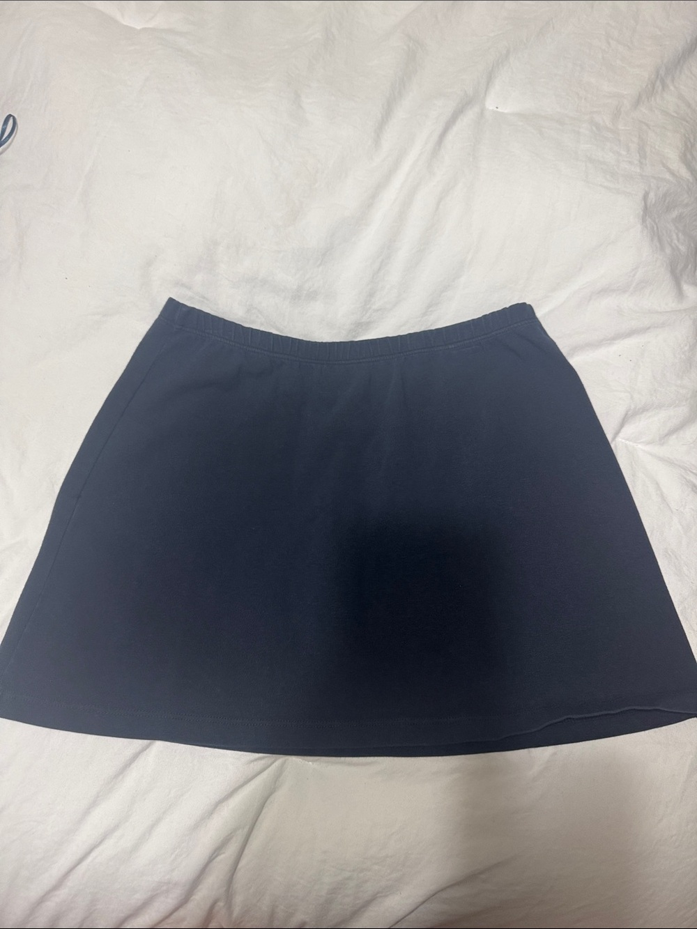 Brandy Melville navy mini skirt.  Elastic waist, made in Italy.